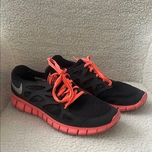 Nike Black and Pink Athletic Shoes with Flexible Design